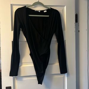 Marcella black body suit. Flattering criss cross design. Size small worn once.
